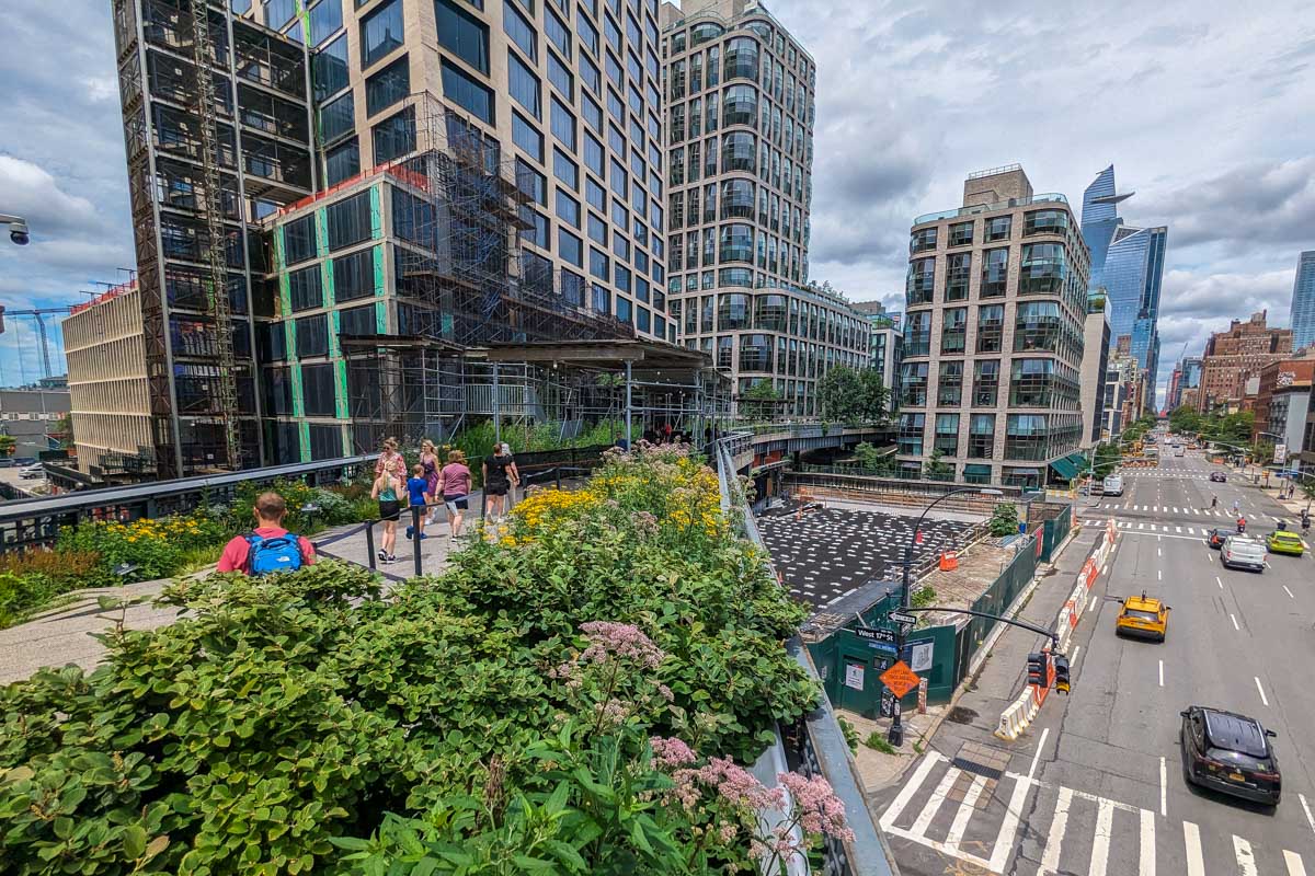 Wide angle shot of The High Line traveling avoce NYC streets