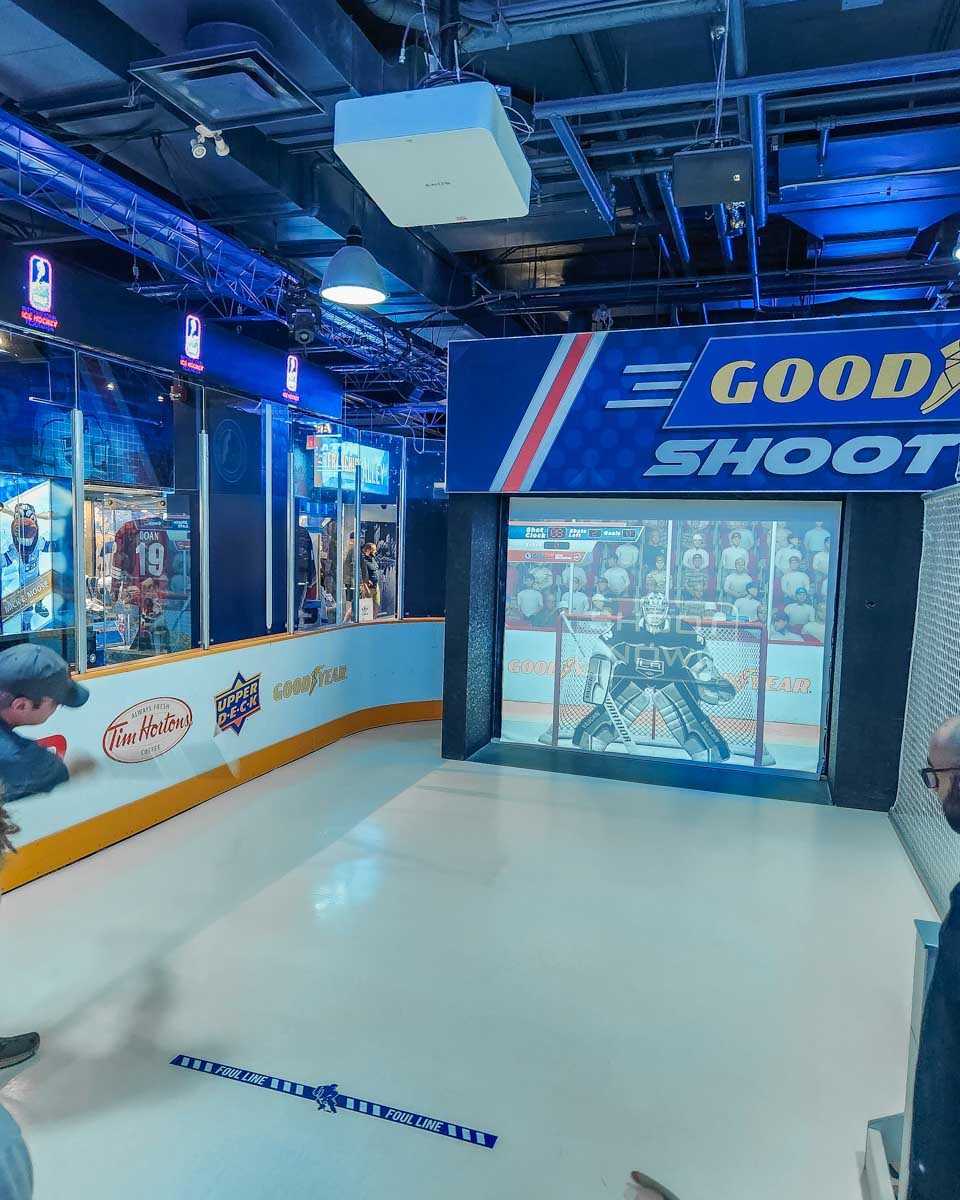 A man plays Goodyear Shootout at the Hockey hall of Fame in Toronto, Canada