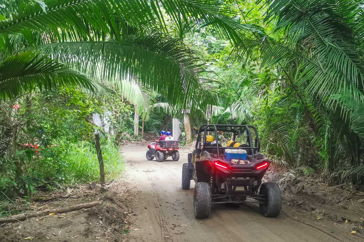 ATV buggy drives through the forest in Tulum, Mexico