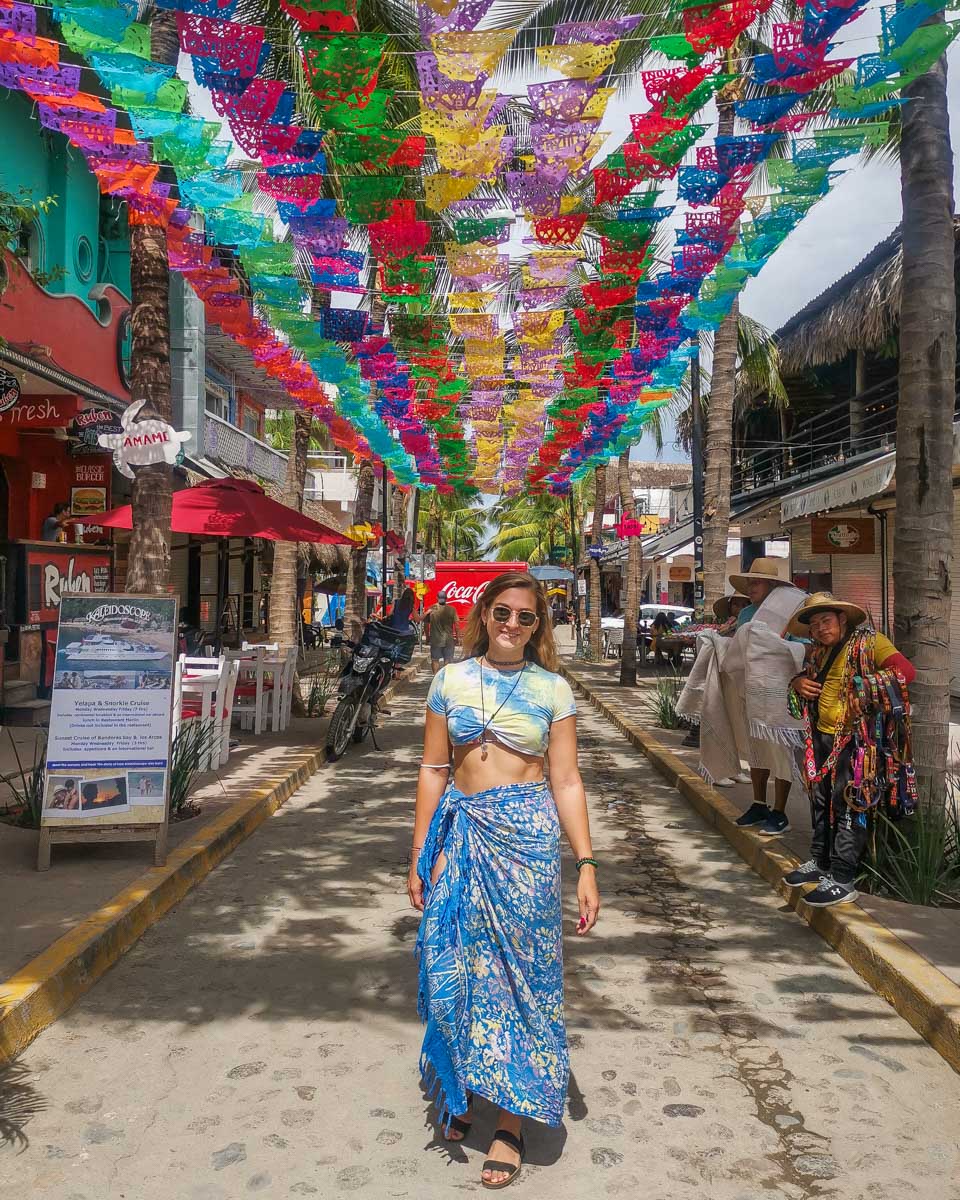 Bailey poses for a photo on a famous street in Sayulita Mexico on a photo tour from Puerto Vallarta, Mexico