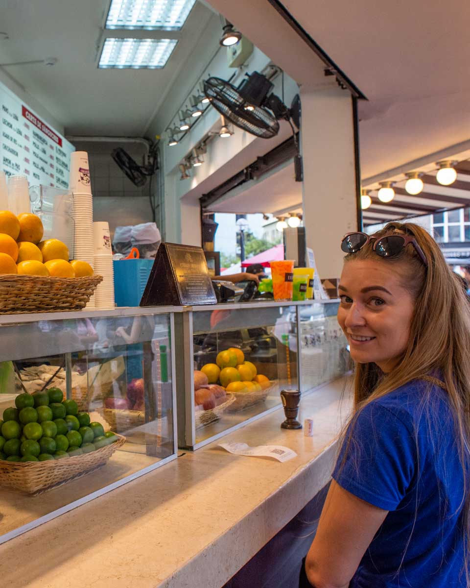 Bailey waits for a famous sandwich in Lima Peru on a food tour
