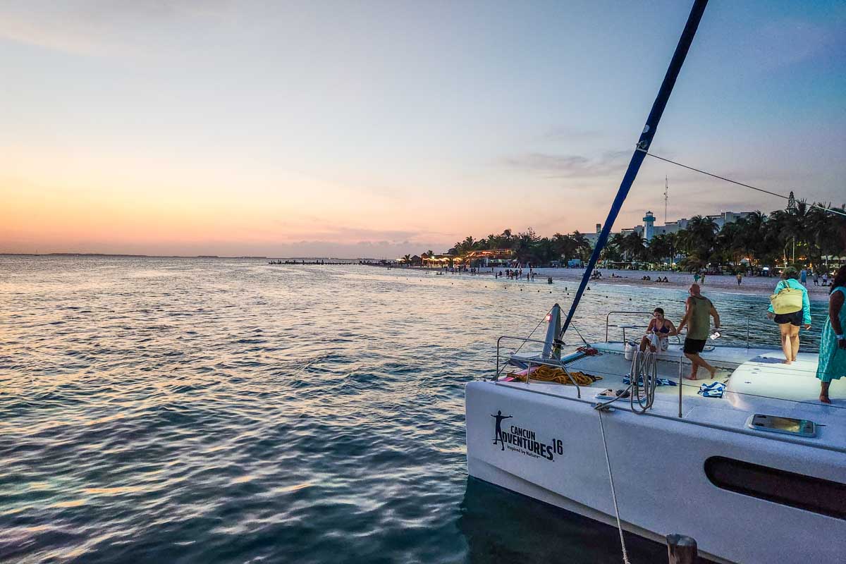 Catamaran cruise at sunsets sails back to Playa del Carmen, Mexico