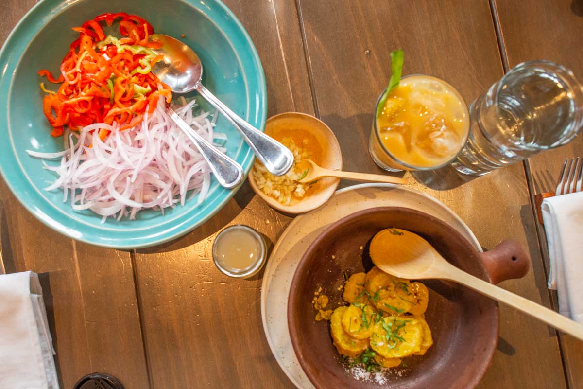 Cooking a local dish on a food tour in Lima Peru