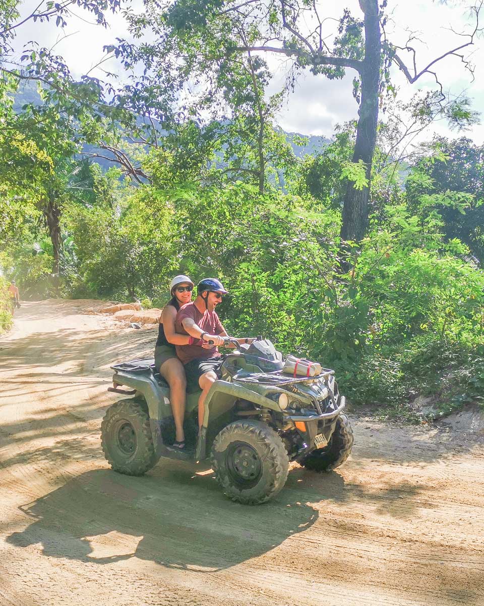 Daniel and Bailey ride an ATV in Playa del Carmen, Mexico