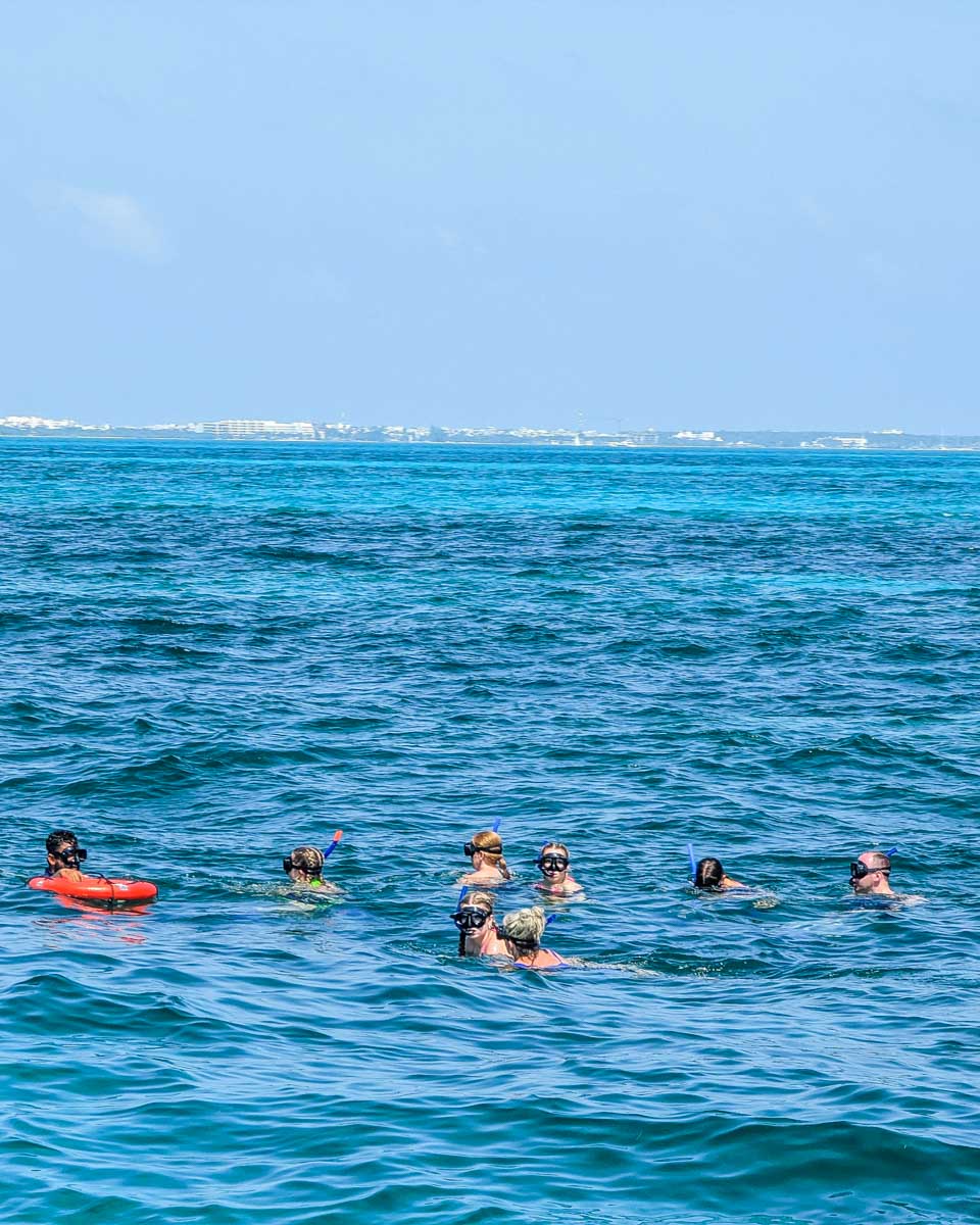 People snorkel on a sunset catamaran cruise in Playa del Carmen, Mexico