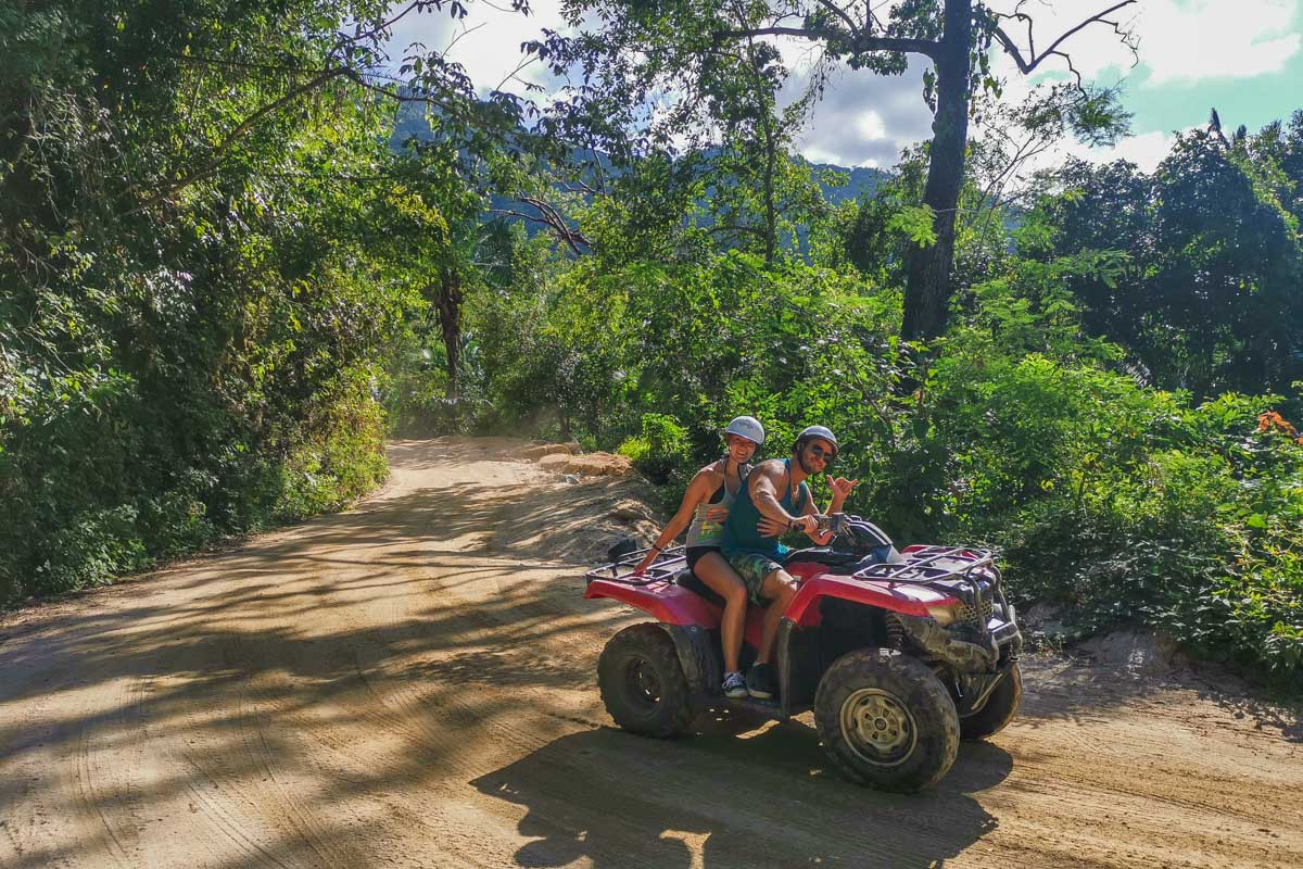 Two people ATVing on a tour from Playa del Carmen, Mexico