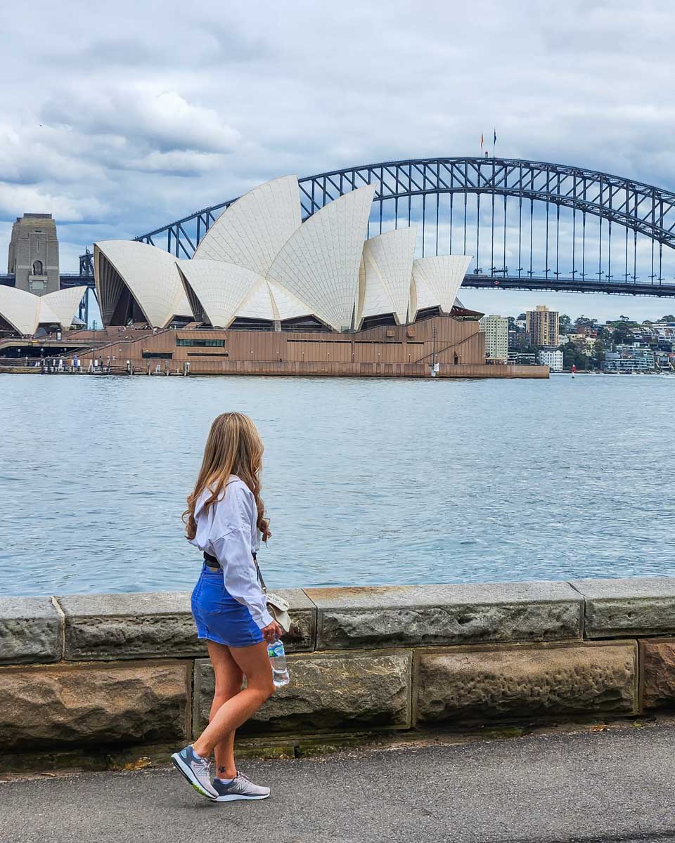 Bailey enjoys the view from Mrs Macquarie's Chair in Sydney of the opera house and harbour bridge