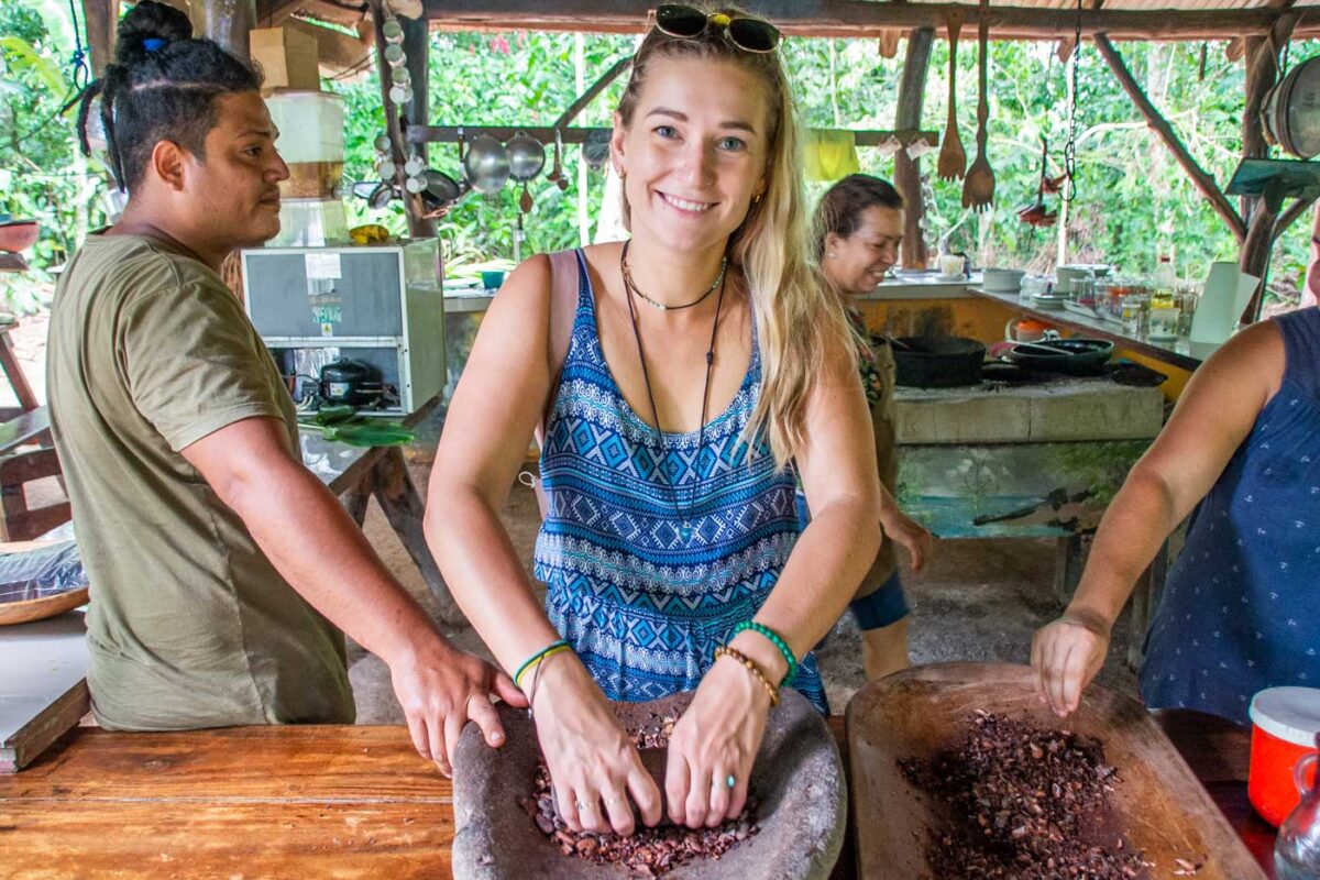 Bailey grinds cacao a traditional way in Medellin, Colombia