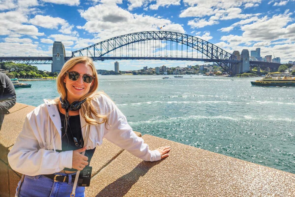 Bailey poses for a photo with the Sydney Harbour Bridge on a tour of the Sydney Opera House