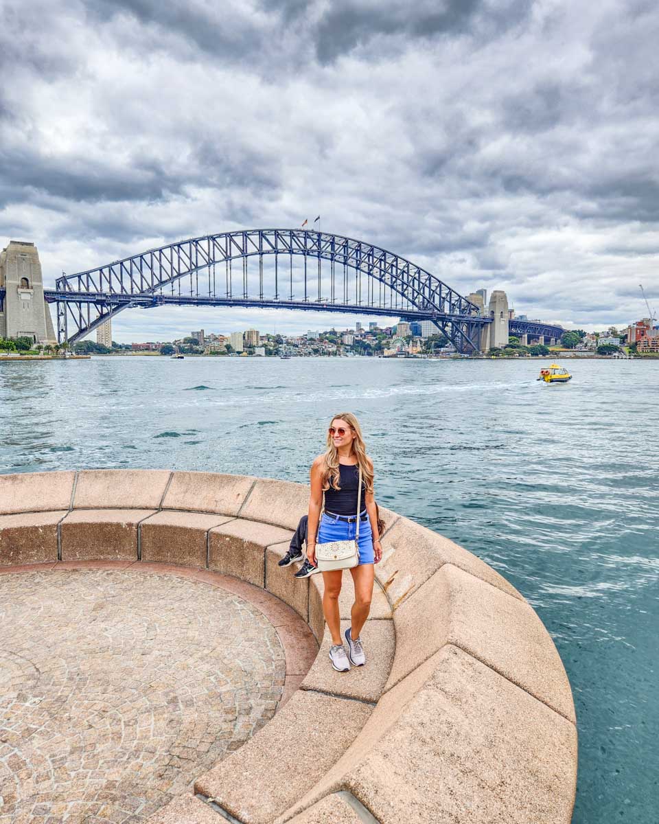 Bailey poses for a photo with the Sydney Harbour Bridge