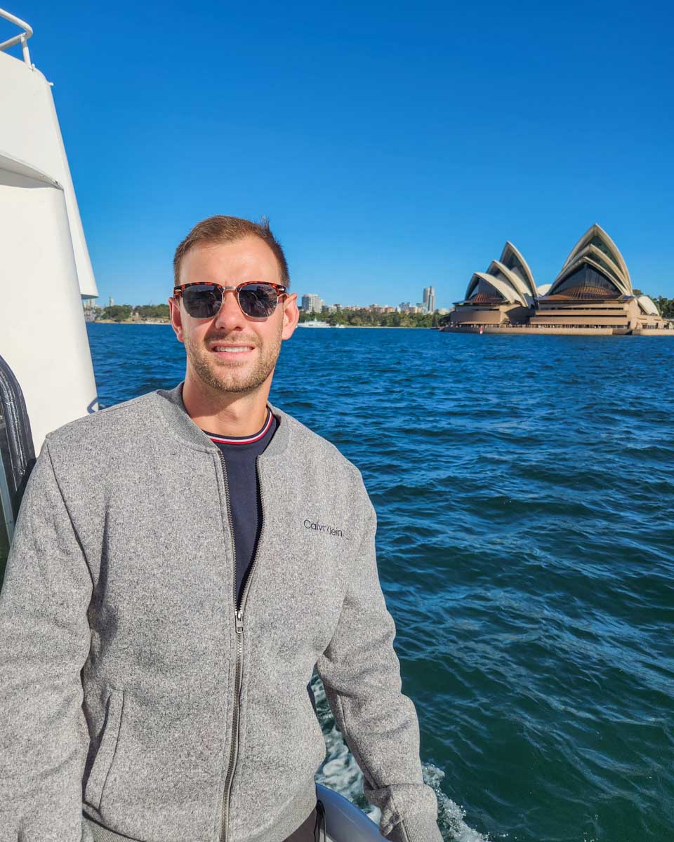 Daniel poses for a photo on a Sydney Harbour cruise