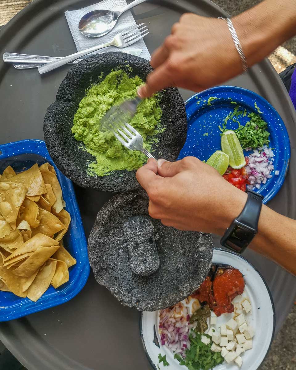 Making fresh guacamole on a food tour in Puerto Vallarta, Mexico