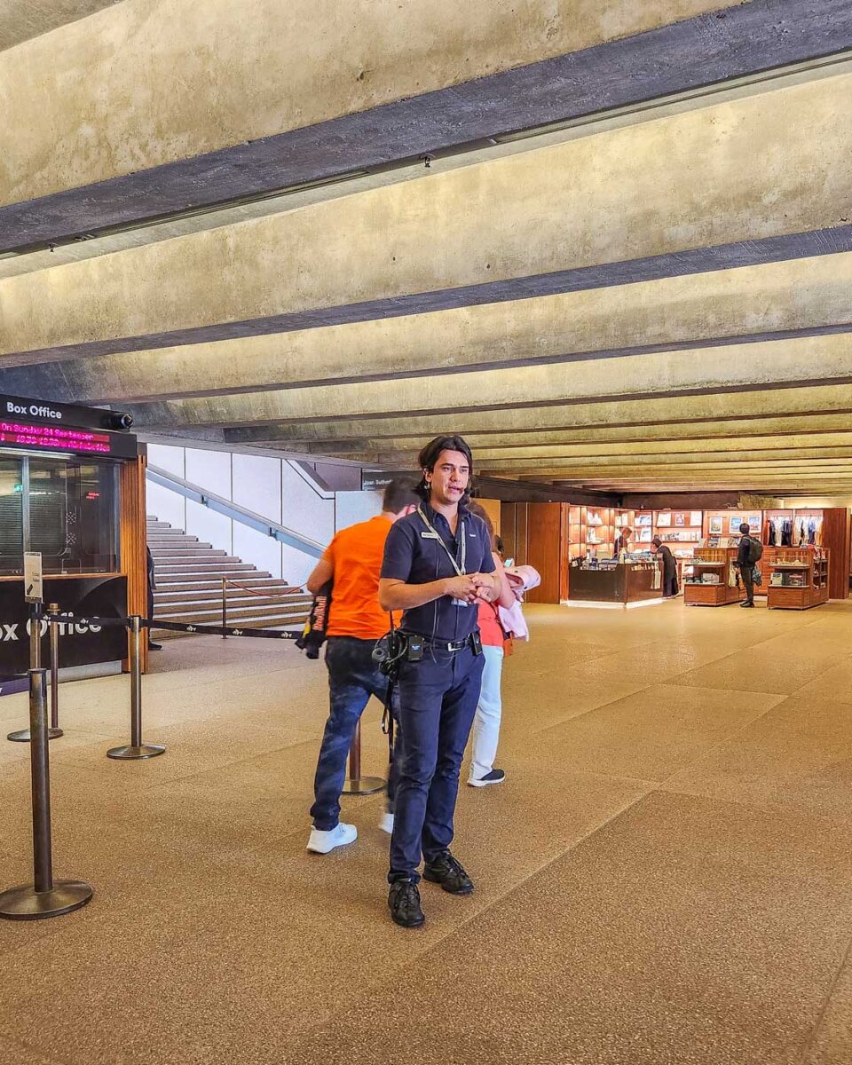 Our guide talks about the Sydney Opera House on a tour