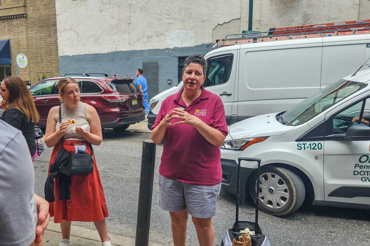 Our tour guide talks to our group during our food tour in Philadelphia