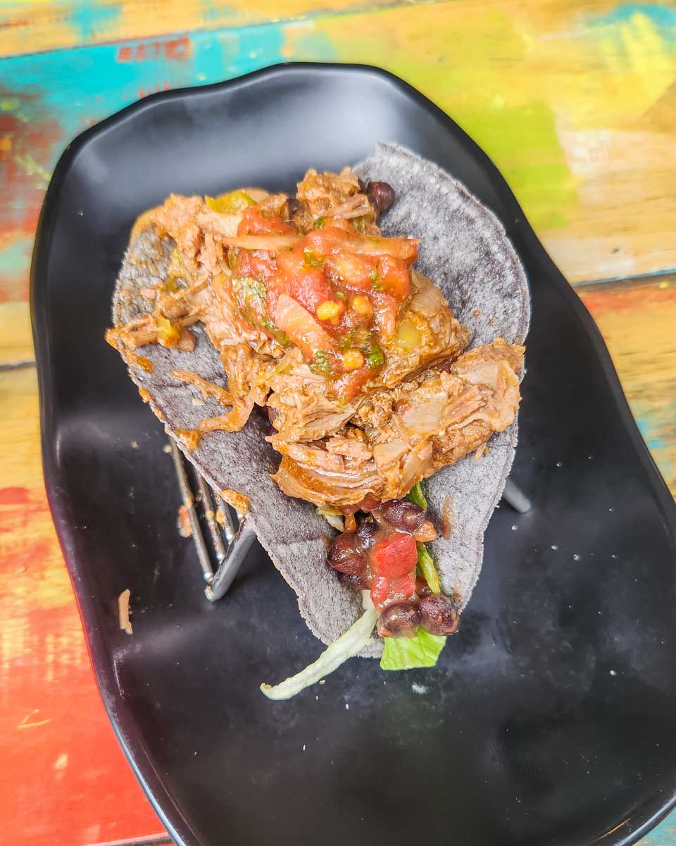 Tasting a taco on a food walking tour around Sydney, Australia