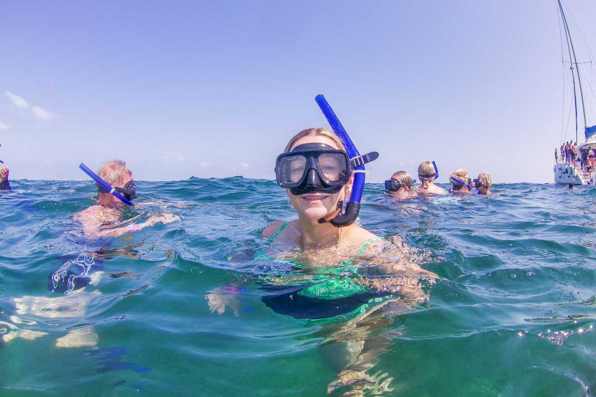 Bailey above the water with a snorkel on during a tour in Puerto Morelos, Mexico