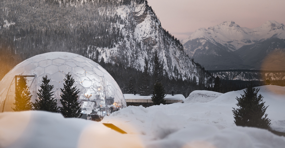 a dome in the snow where people eat inside in Banff