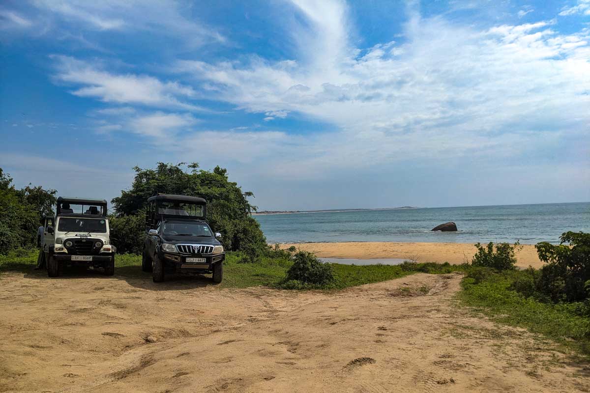 Jeeps parked in the sand at the beach in Yala National Park Sri Lanka
