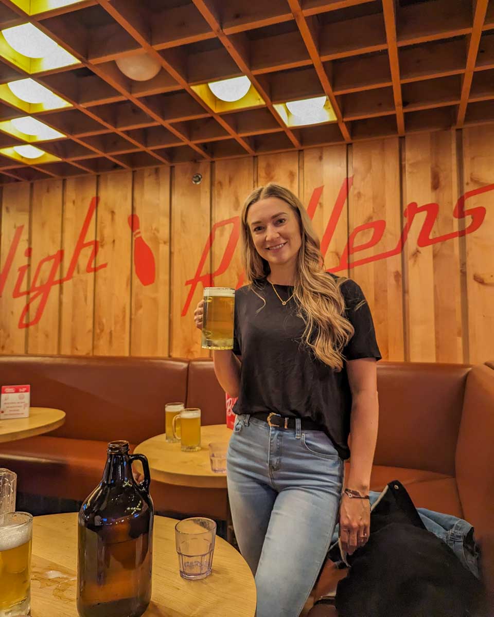 bailey with a beer at High Rollers in Banff