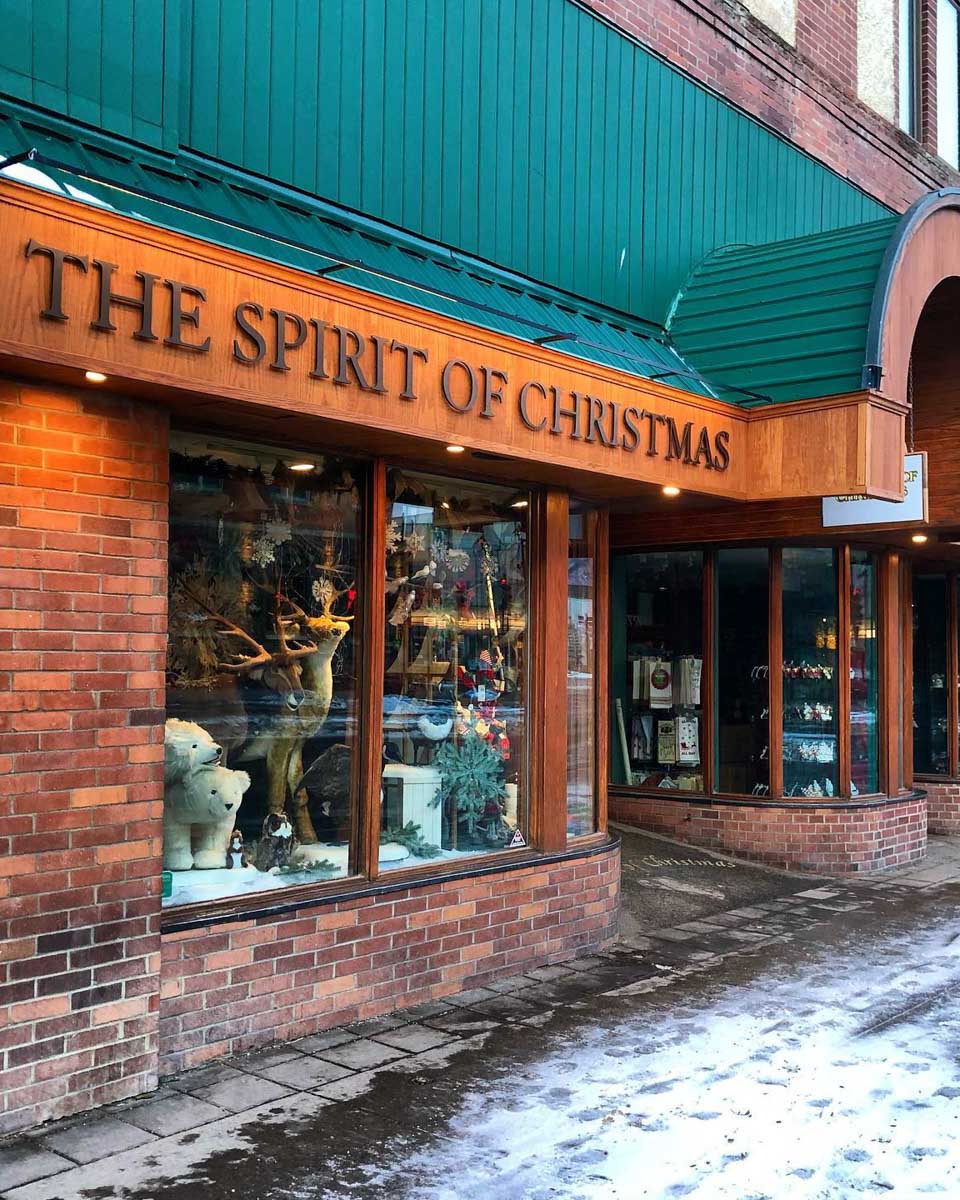 the outside of the Spirit of Christmas store on Banff Ave in the winter