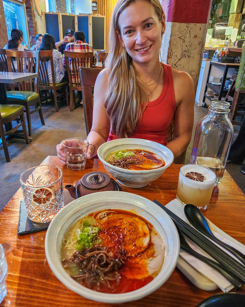 Bailey with her ramen at BOKU Japanese Eats + Drinks in the Toronto Distillery District, Canada