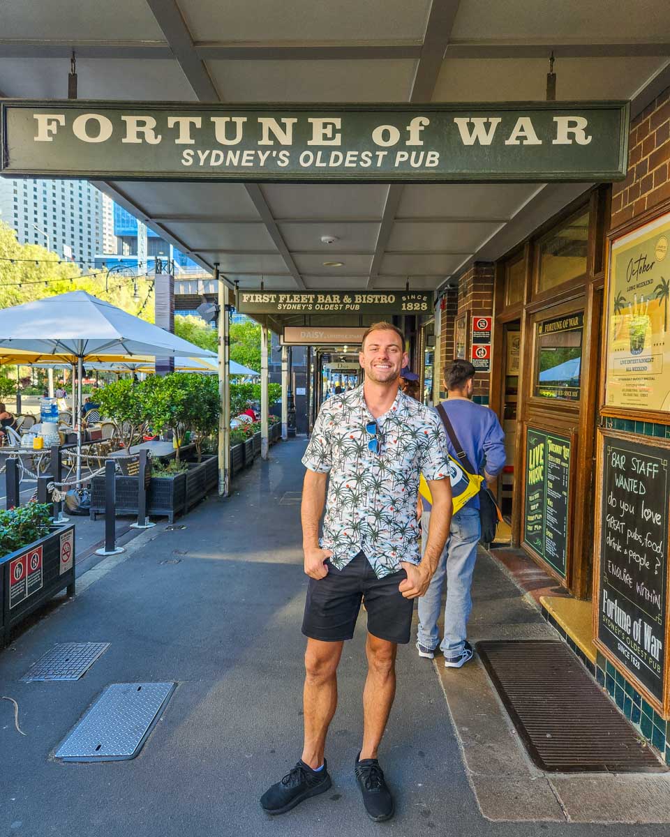 Daniel poses for a photo out the front of the Fortune of War Pub in The Rocks, Sydney