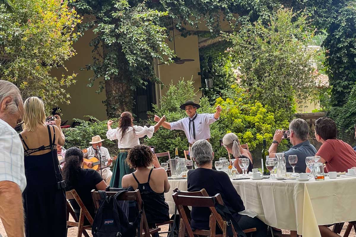Two Gauchos dance while we eat and drink wine on our Gaucho tour from Buenos Aires