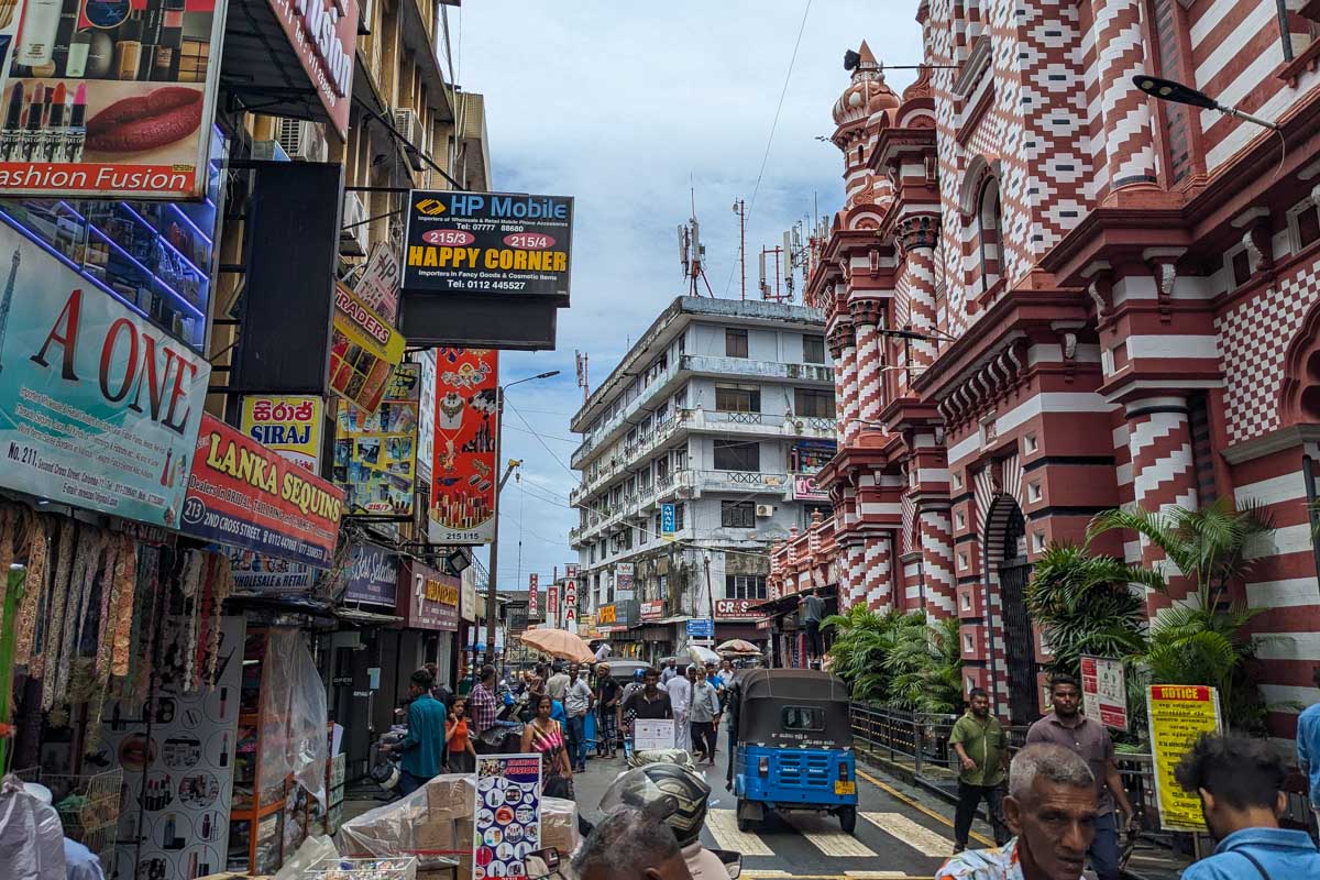 A busy street next to the jami ul-alfar mosque Colombo Sri Lanka