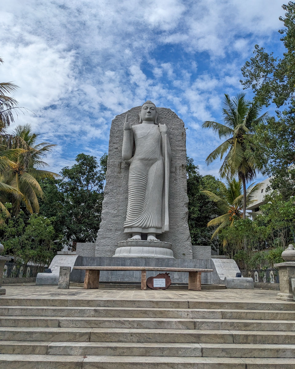 A large standing stone Avukana Buddha statue on the side of the road Colombo, Sri Lanka