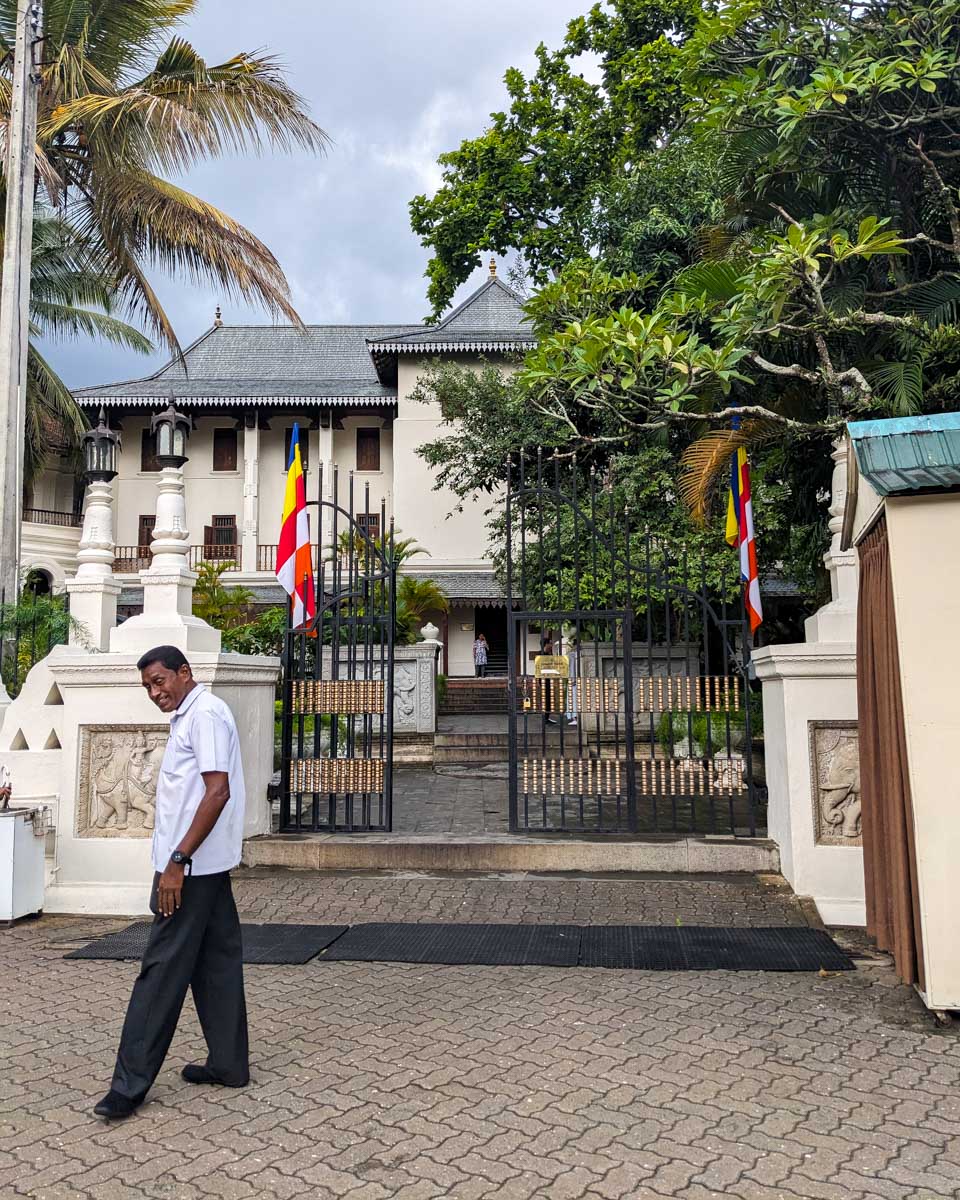 A local Sri Lankan man laughs and makes a joke as we enter the Sacred Tooth Relic Kandy Sri Lanka