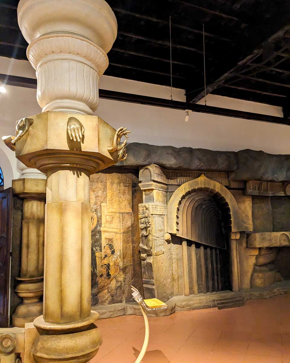 A museum displaying a pillar with symbolic markings in Kandy Sri Lanka