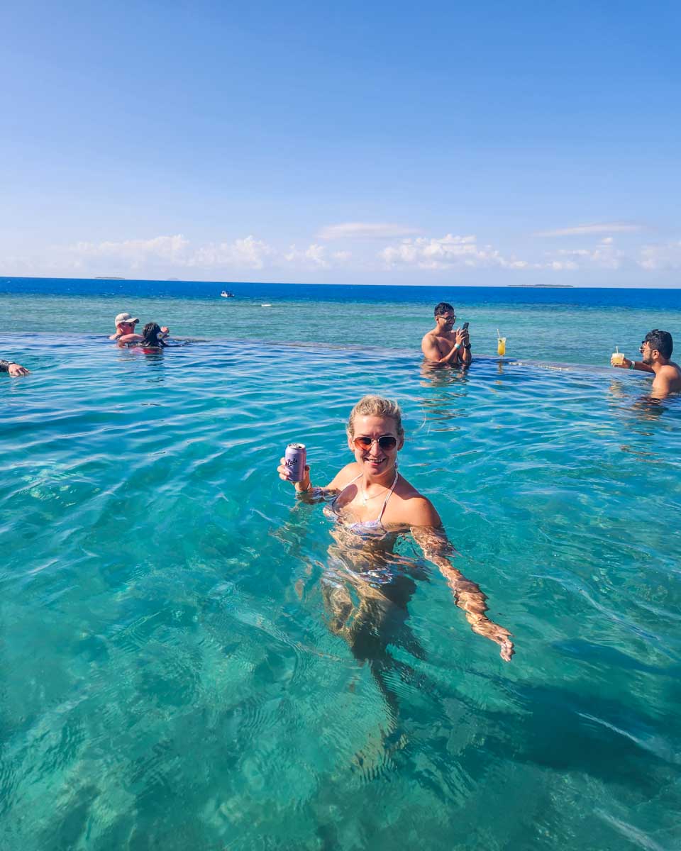 Bailey enjoys a drink at Malamala Beach Club in the infinity pool