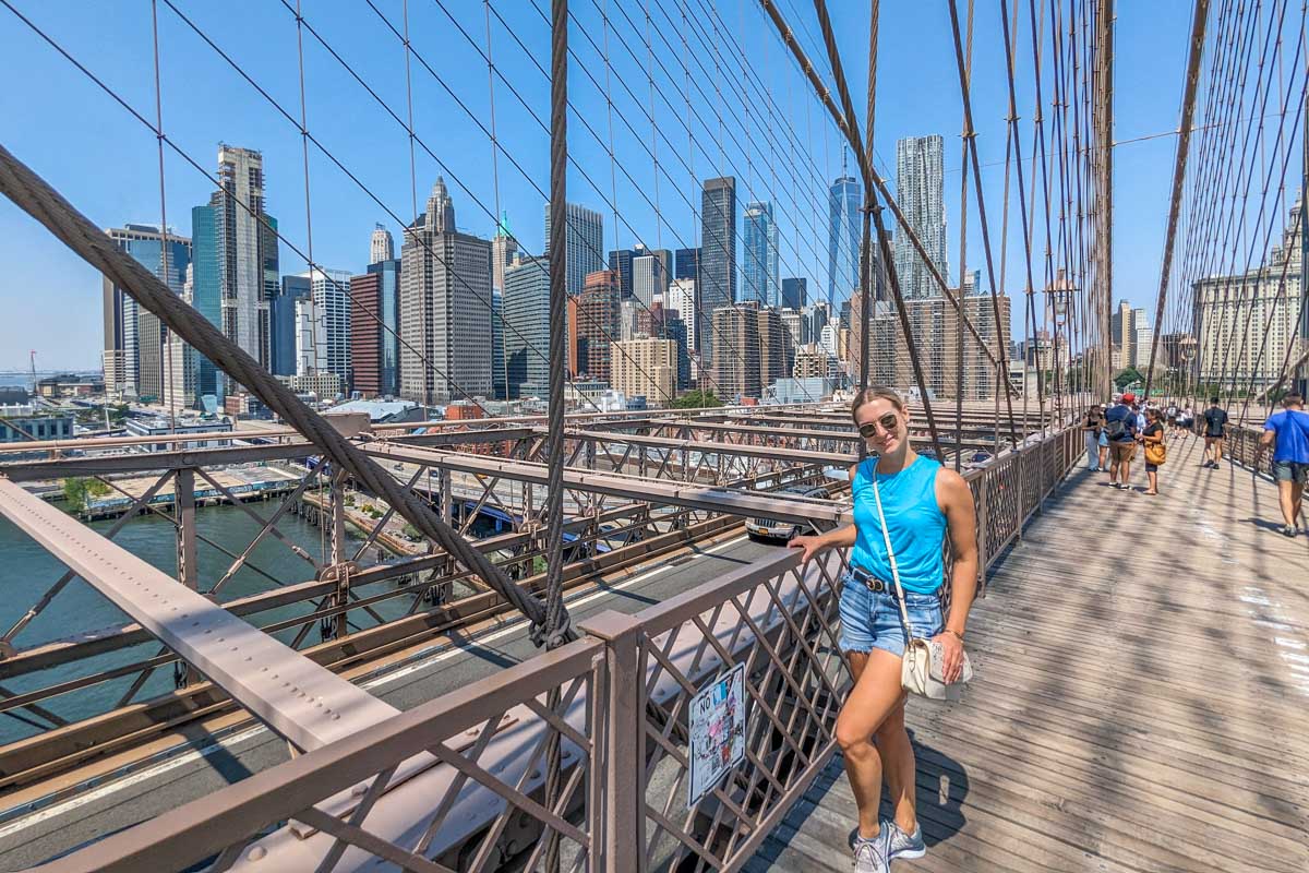 Bailey poses for a photo on the Brooklyn Bridge in NYC
