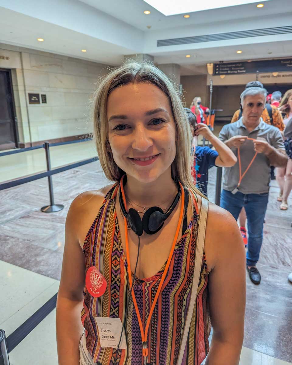 Bailey poses for a photo with her headset during a tour of the United States CapitolĀ in Washington DC