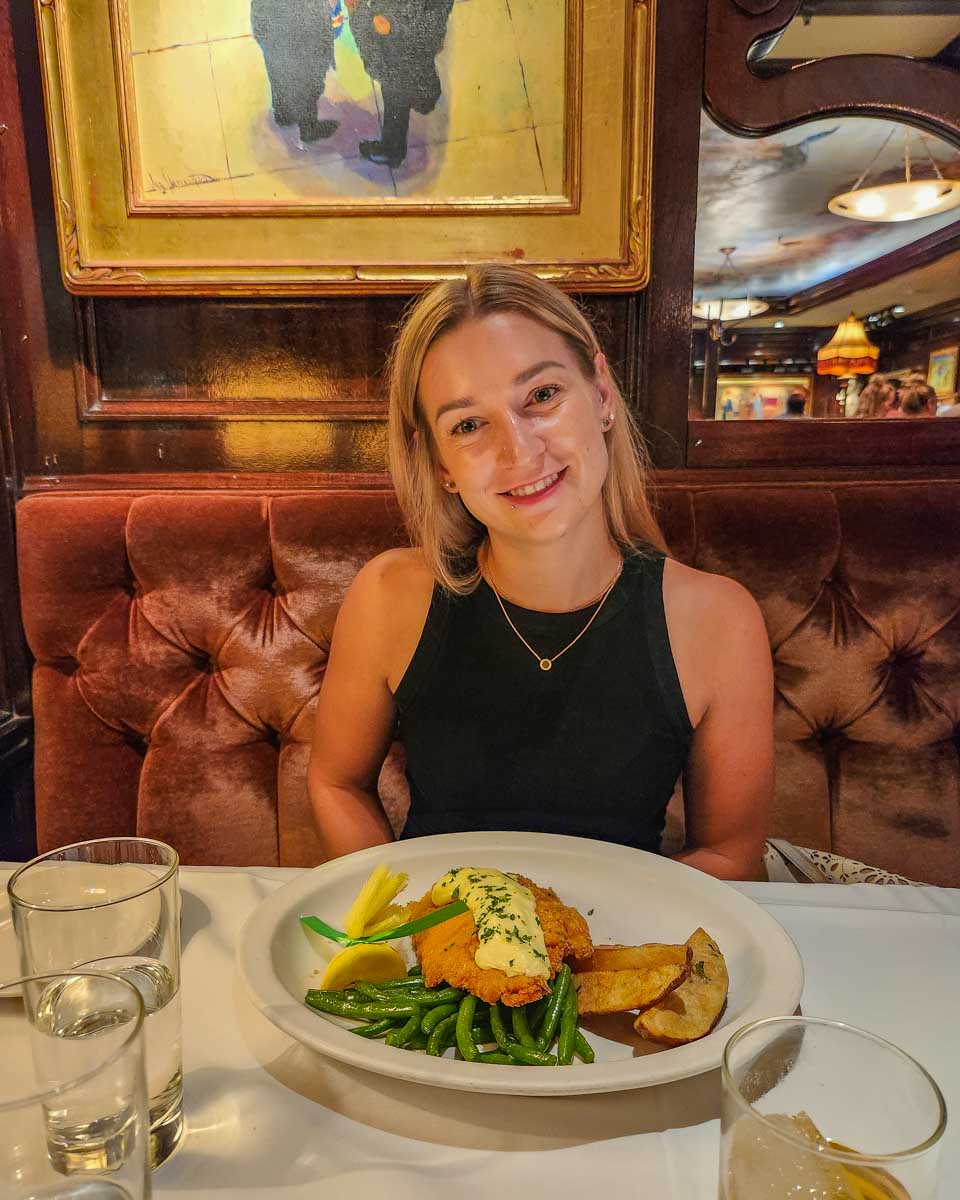 Bailey sits down with her meal at The Old Ebbitt Grill in Washington DC