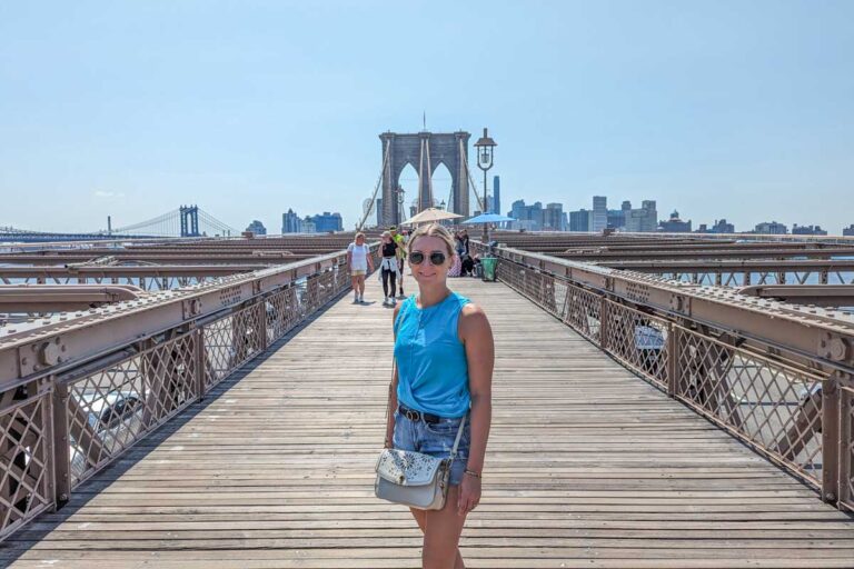 Bailey stands on the Brooklyn Bridge in New York City
