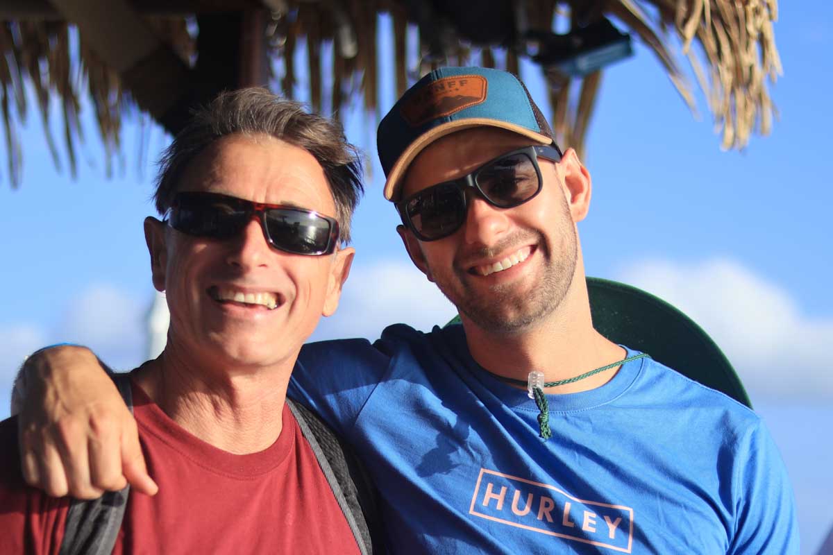 Daniel and his Dad pose for a photo on Seventh Heaven Fiji