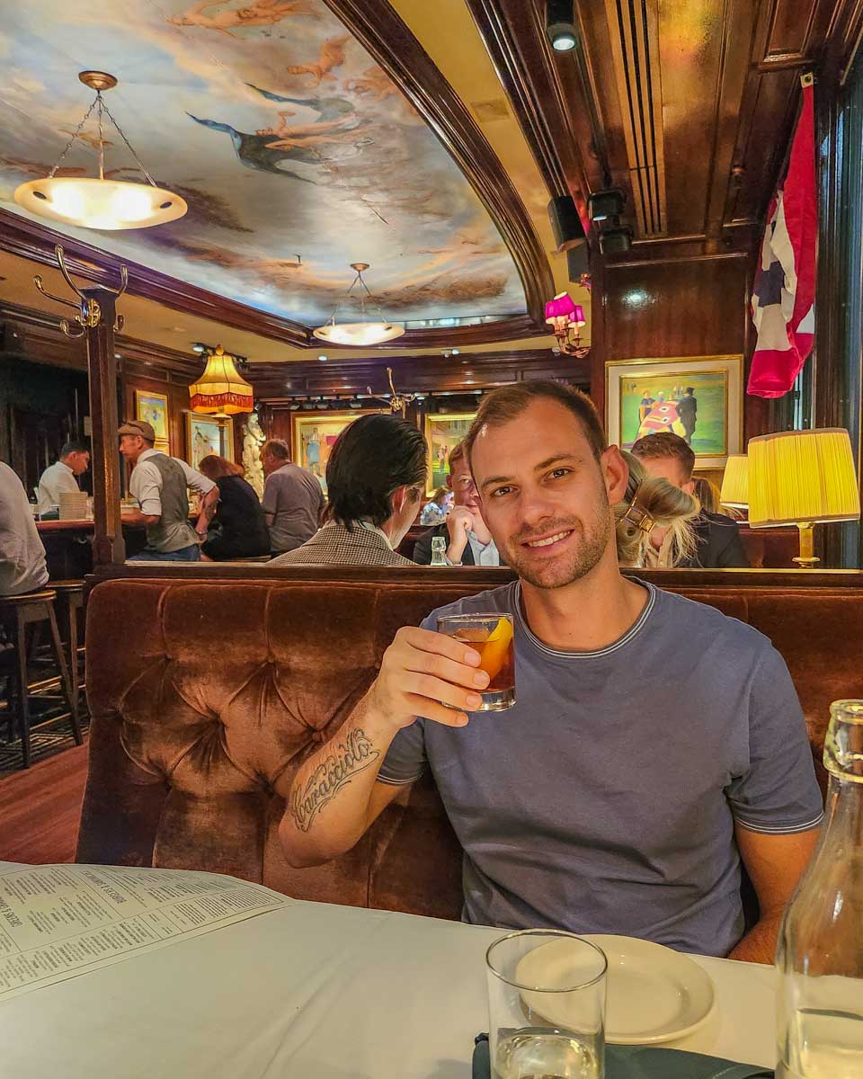 Daniel enjoys a drink at The Old Ebbitt Grill in Washington DC, USA
