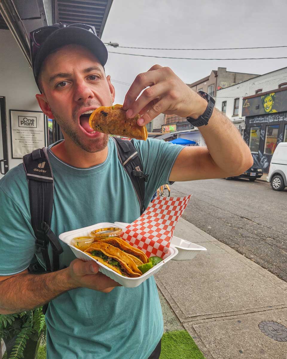 Daniel tastes an authentic taco in the Kensington market on a food tour in Toronto