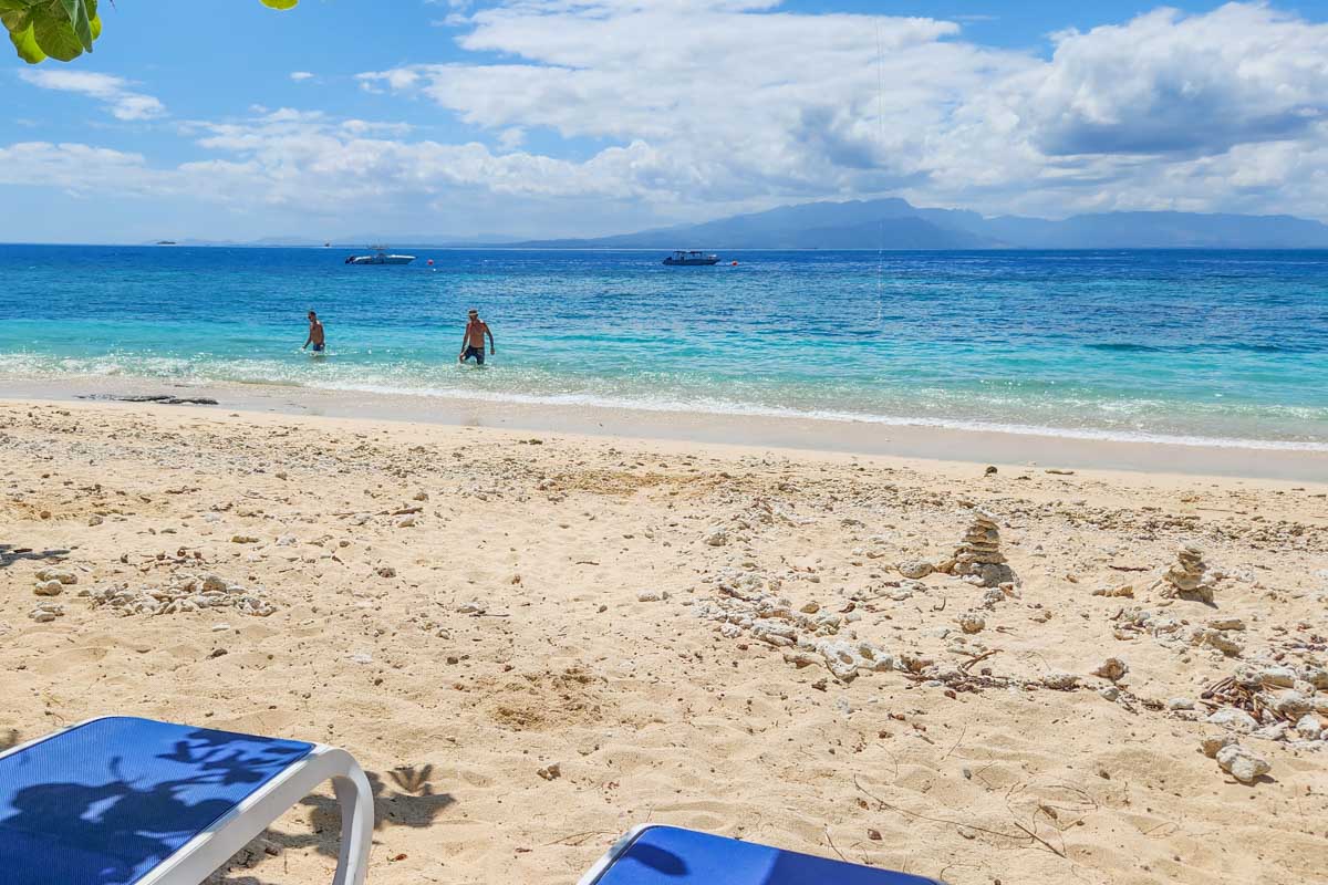 Day beds on the beach at South Sea Island, Fiji