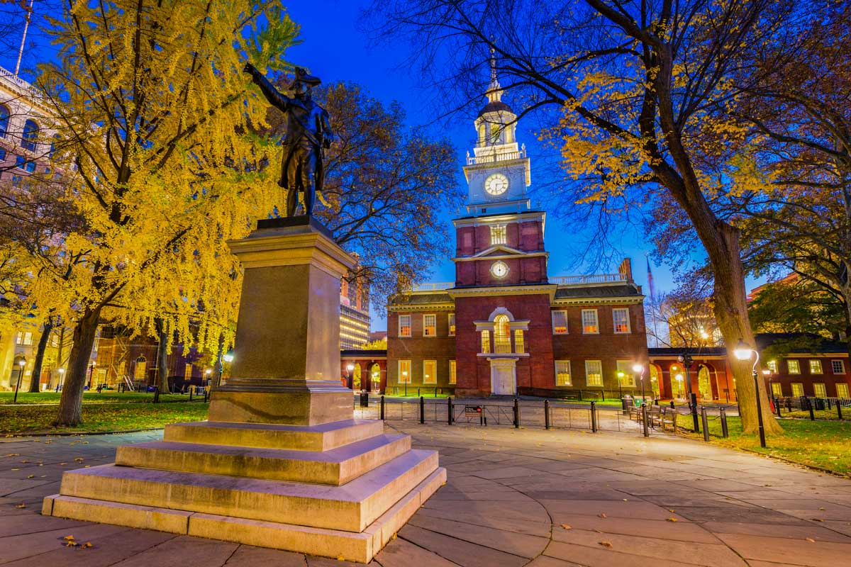 Independence Hall and the Barry statue at night on a ghost tour in Philadelphia, USA
