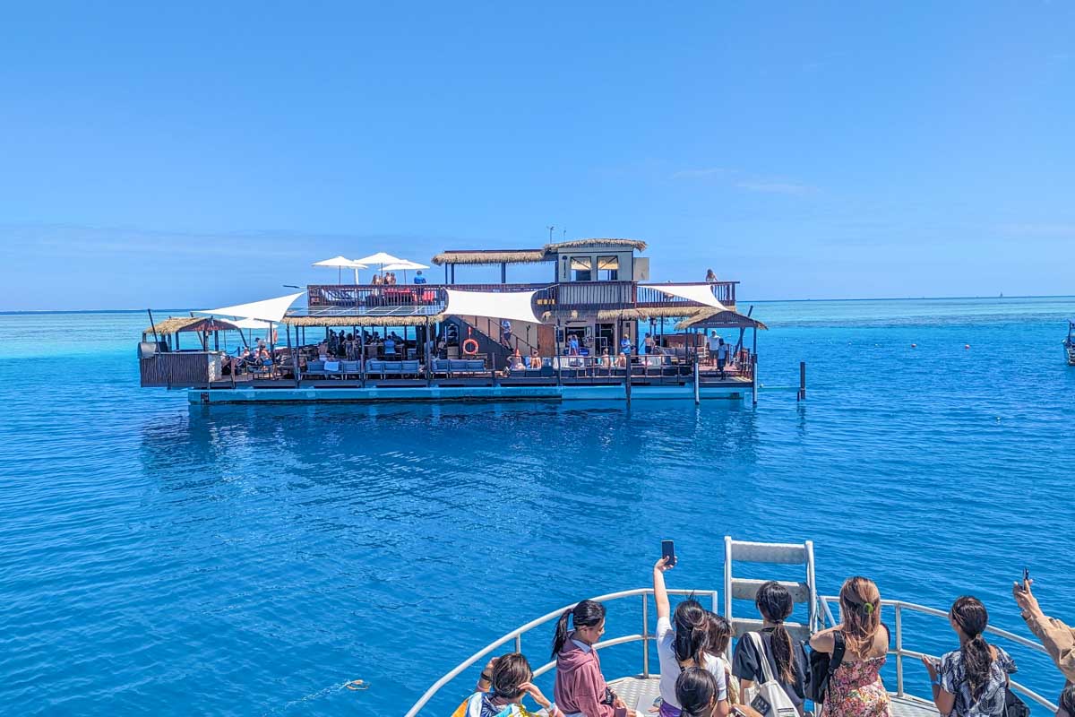 Our boat arriving at Seventh Heaven Fiji Floating Platform
