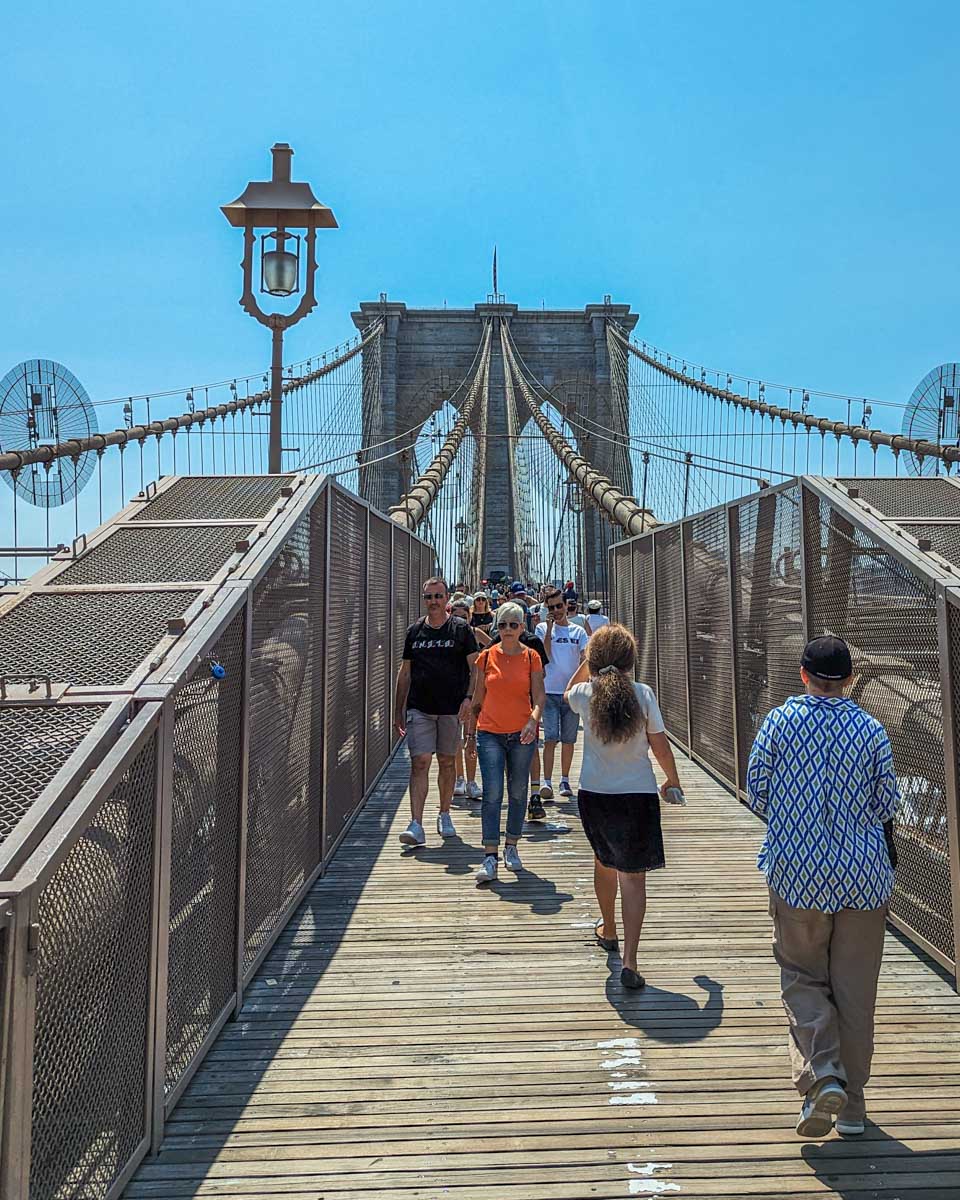 People run along the Brooklyn Bridge Pathway