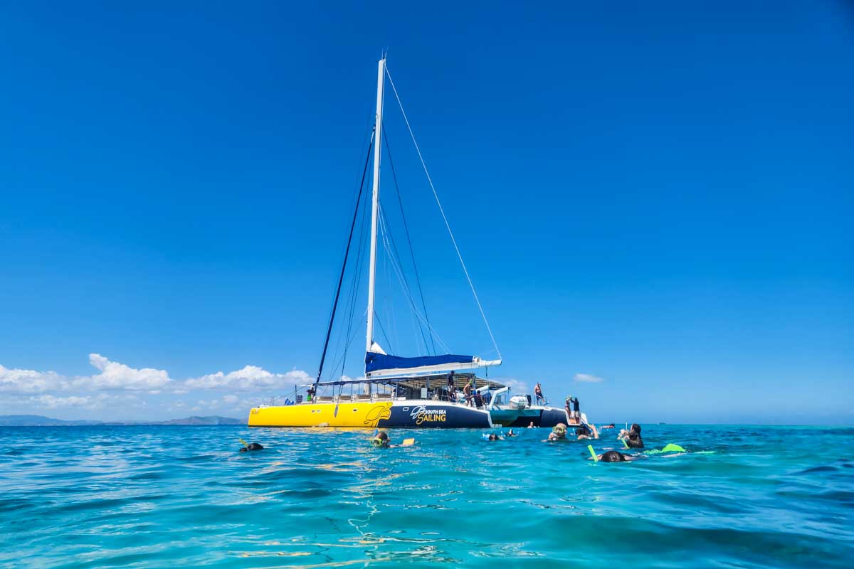 The South Sea Sailing Full Day Cruise boat anchored in the water