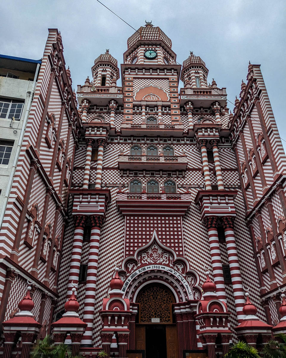 The front of the red and white patterend Jami Ul-Alfar Mosque built in 1908 Colombo, Sri Lanka