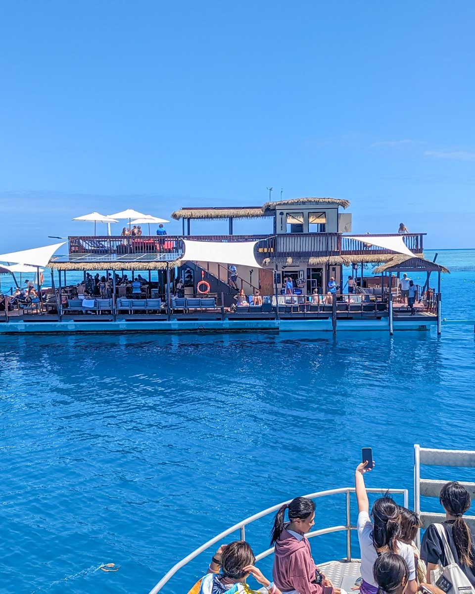 The transport boat arriving at Seventh Heaven Fiji Floating Platform