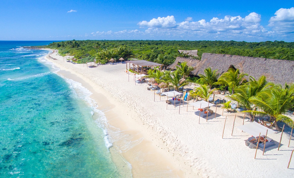 aerial view Punta Venado Beach Club on white sand with day beds