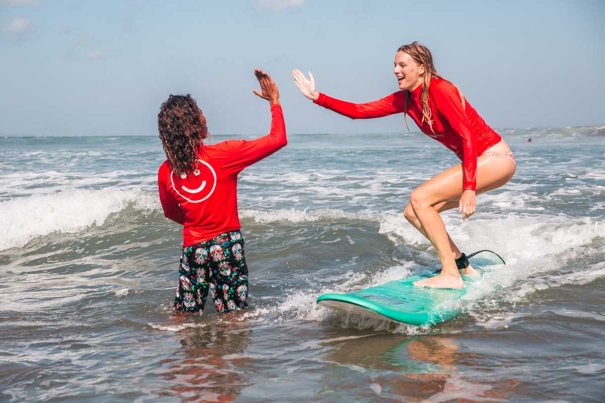 A lady learns to surf in Canggu, Bali