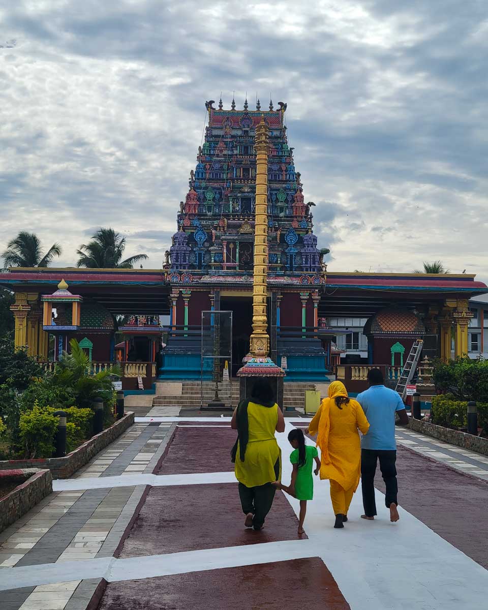 A local family walks into Hindu temple Sri Subramaniya Fiji