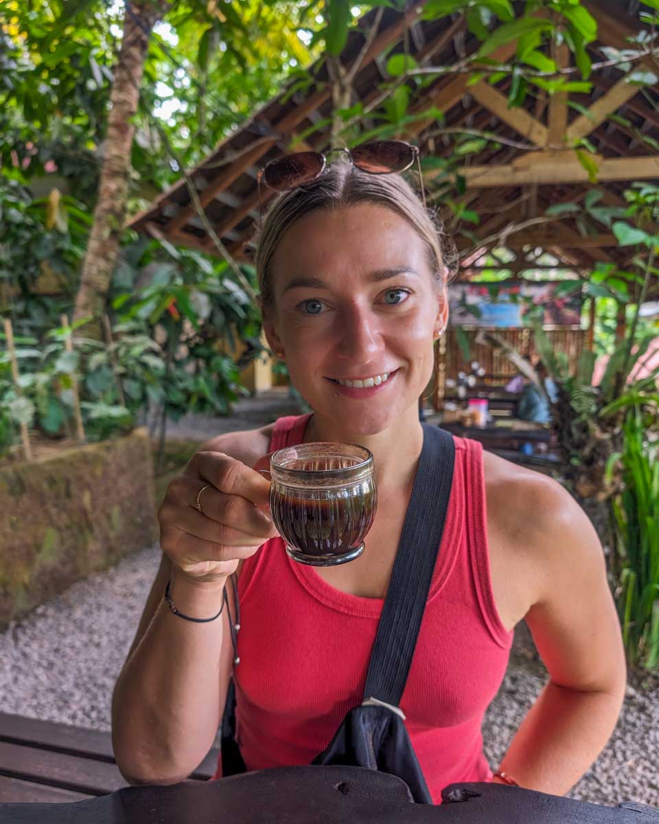 Bailey drinks coffee at a coffee plantation in Bali
